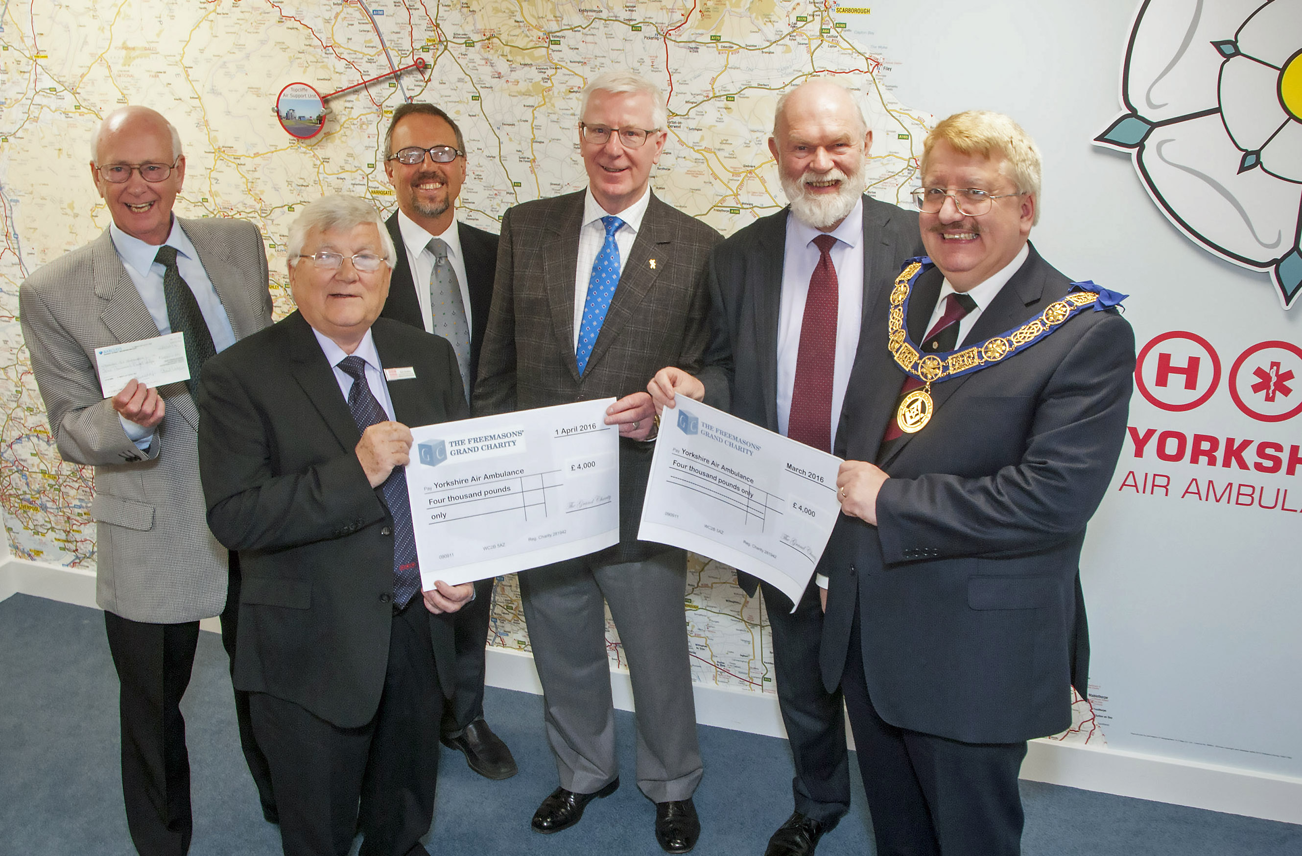 Freemasons with a cheque for the YAA