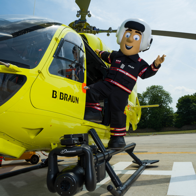Image of Yorkshire Air Ambulance mascot Percy Pilot with helicopter