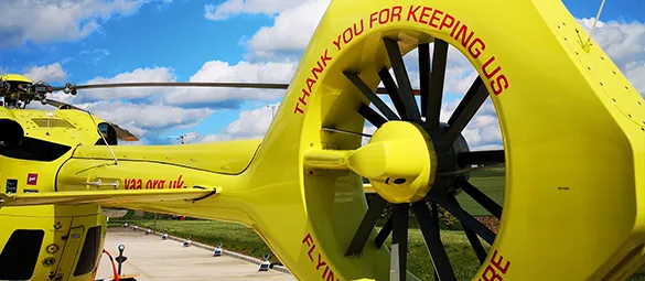 This image shows the back of one of the Yorkshire Air Ambulance Helicopters which displays the words Thank you for keeping us flying over Yorkshire