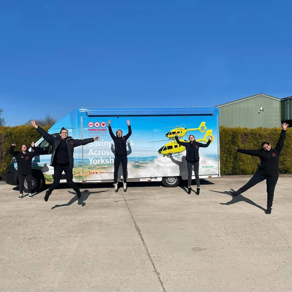 Members of the Yorkshire Air Ambulance fundraising team in from of their promotional vehicle